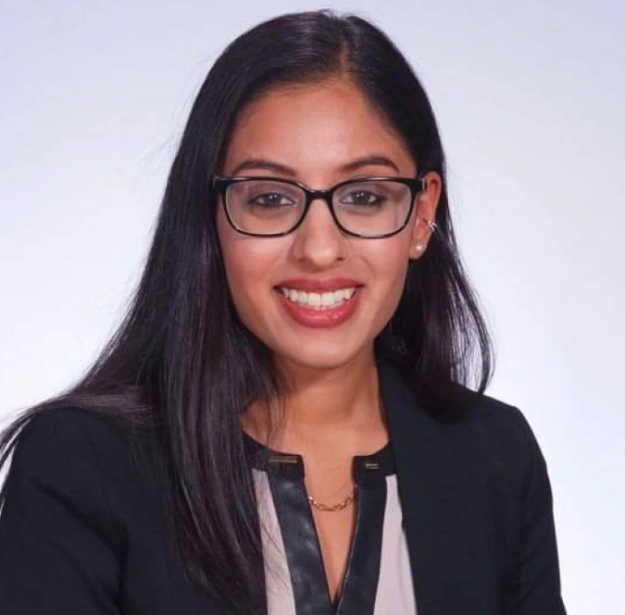 Dr. Kavita Shah, dentist at Fitchburg dental practice, smiling in professional portrait.