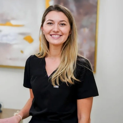 Tori Hatch, dental team member at Fitchburg dental practice, smiling in professional portrait.
